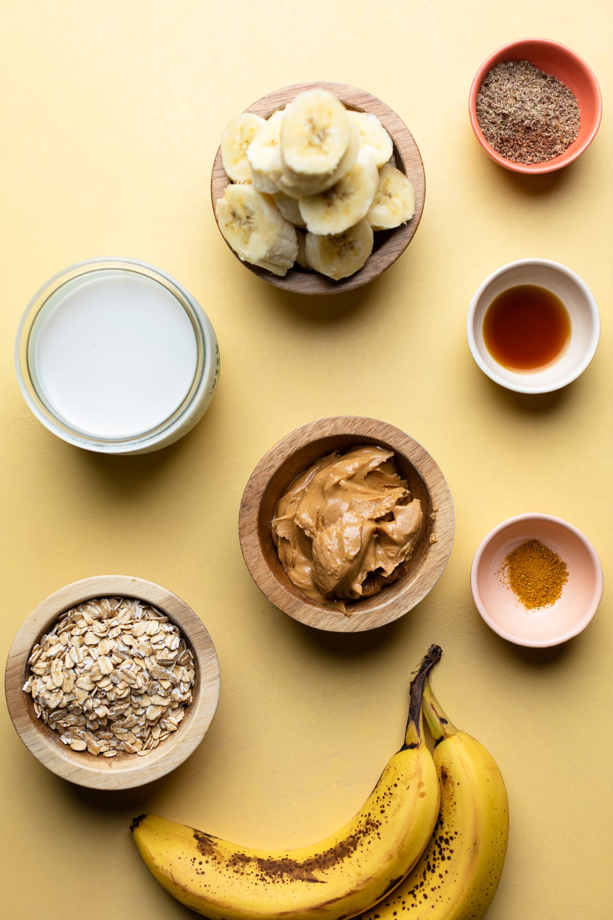 Bowls of ingredients including peanut butter, oats, and cinnamon.