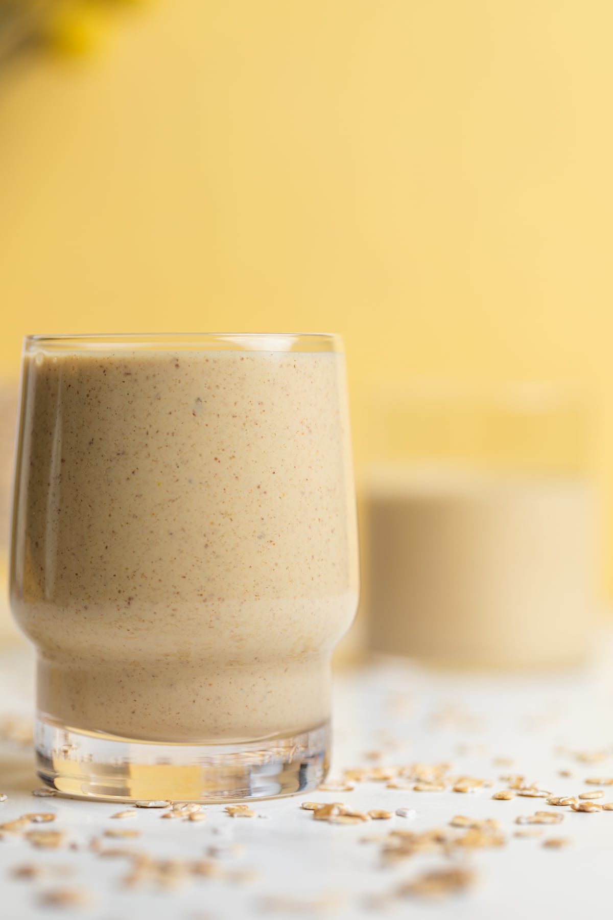 Peanut Butter Banana Oats Smoothie in a small glass.