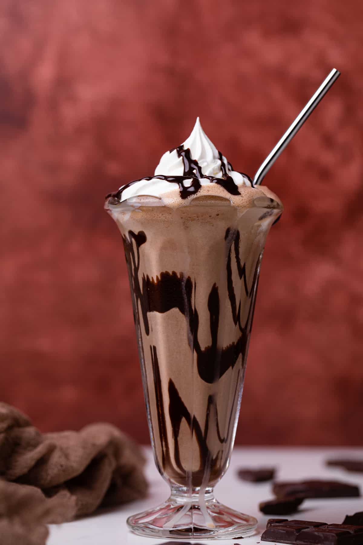 Metal straw in a Dairy-Free Peanut Butter Chocolate Milkshake.
