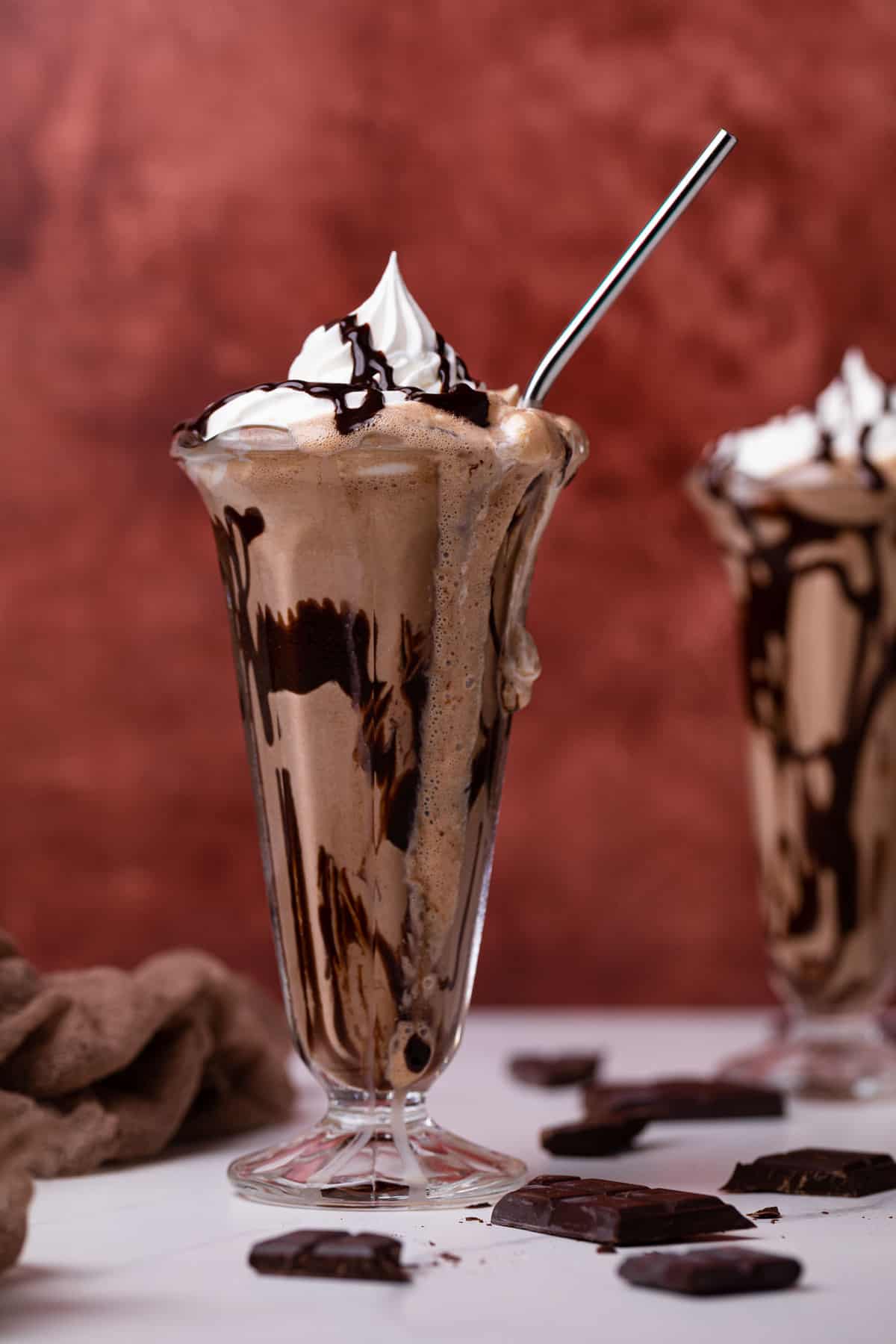 Dairy-Free Peanut Butter Chocolate Milkshake in a tall glass.