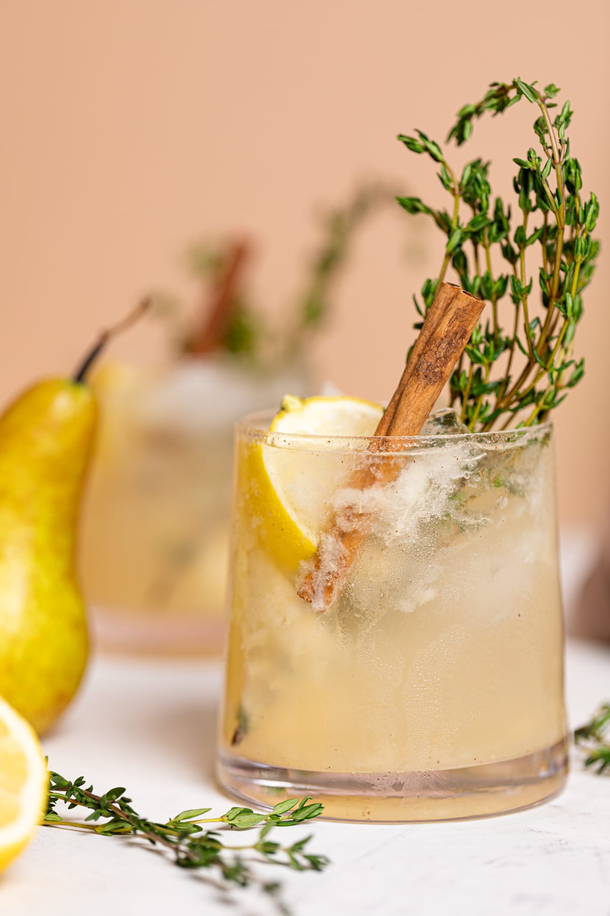 Pear Ginger Lemon and Thyme Drink in a small glass.