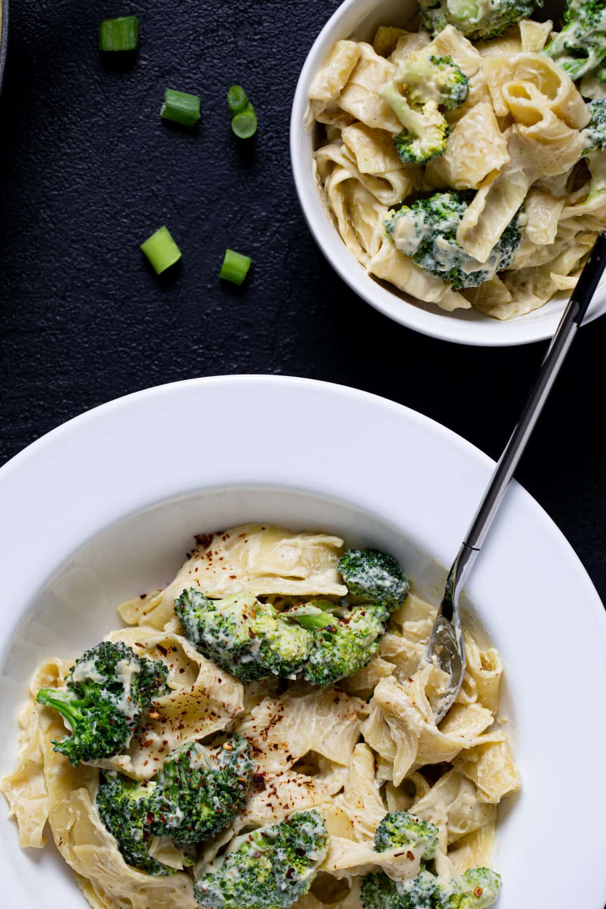 Fork in a plate of Vegan Broccoli Alfredo Pasta.