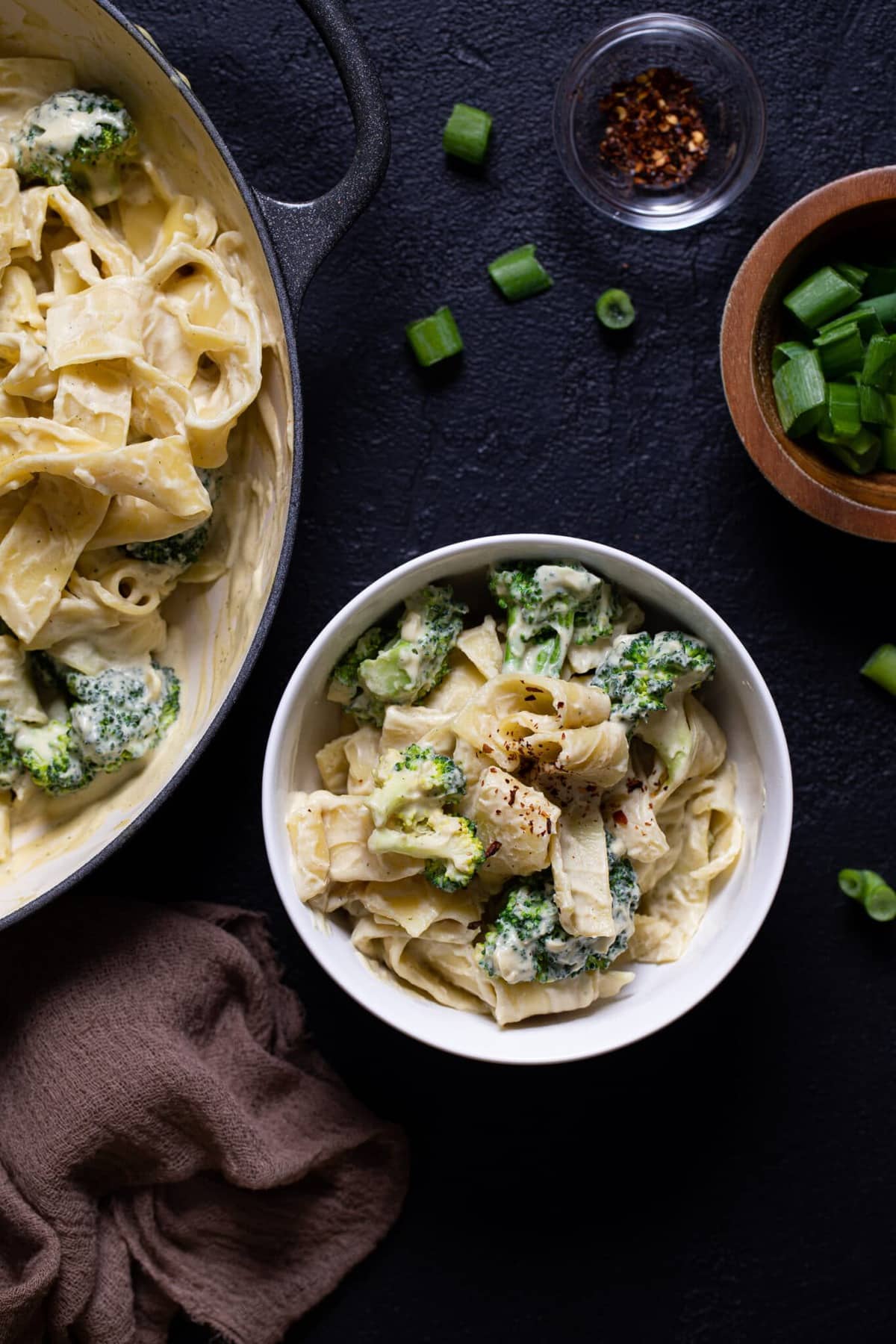 White bowl of Vegan Broccoli Alfredo Pasta.