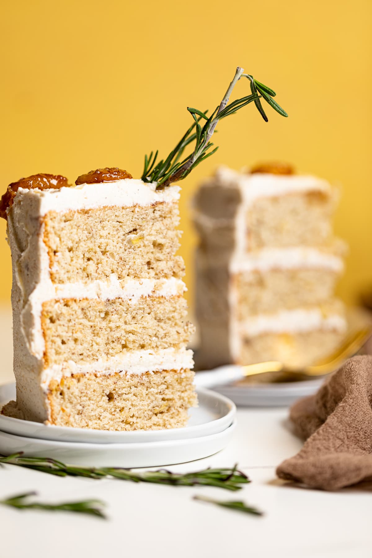 Slices of Vegan Banana Cake with Maple Buttercream on small plates