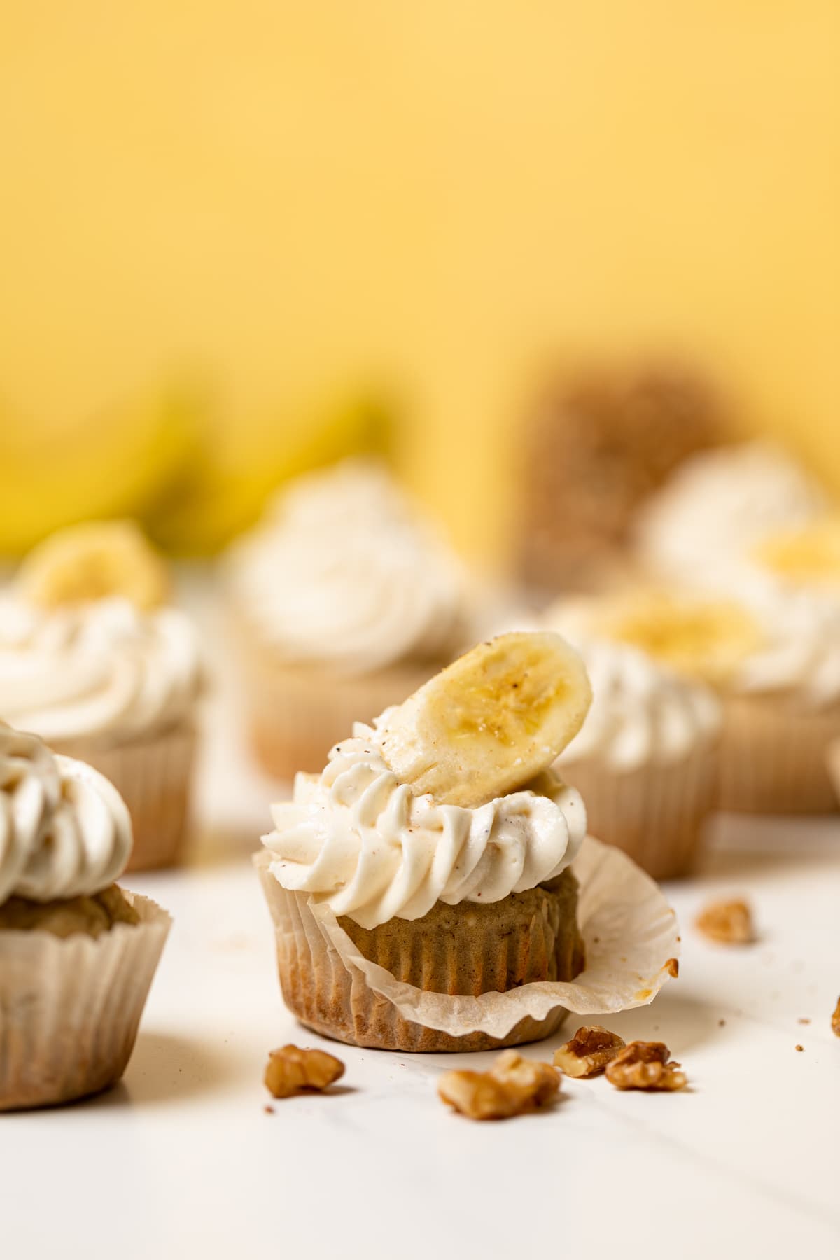 Banana Cupcakes topped with Maple Buttercream and banana slices.