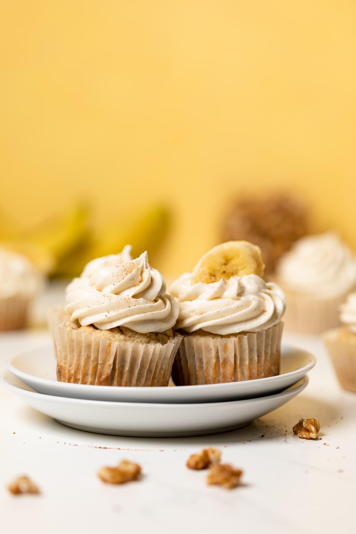 Banana Cupcakes with Maple Buttercream on a plate.