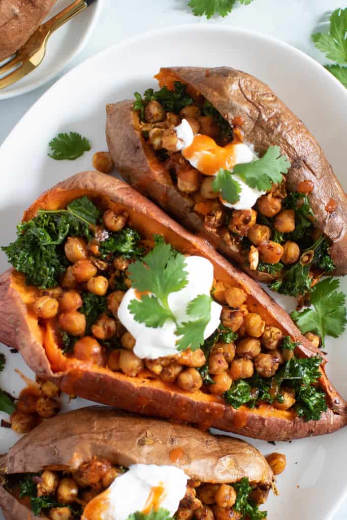 Vegan Stuffed Sweet Potatoes on a white plate.