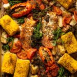 Overhead shot of a Sheet Pan of Garlic Herb Salmon, Lobster, and Veggies