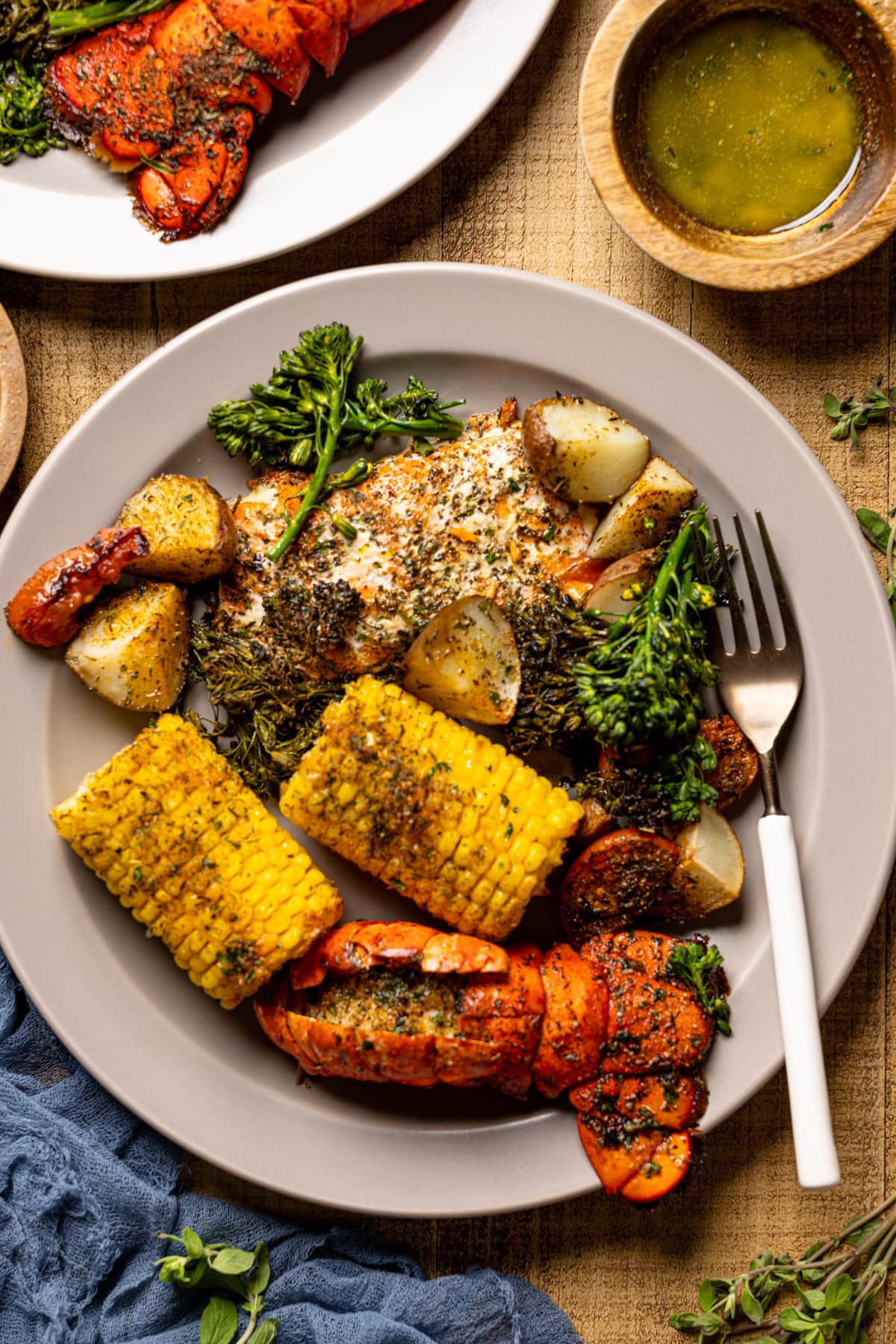 Closeup of Garlic Herb Salmon, Lobster, and Veggies