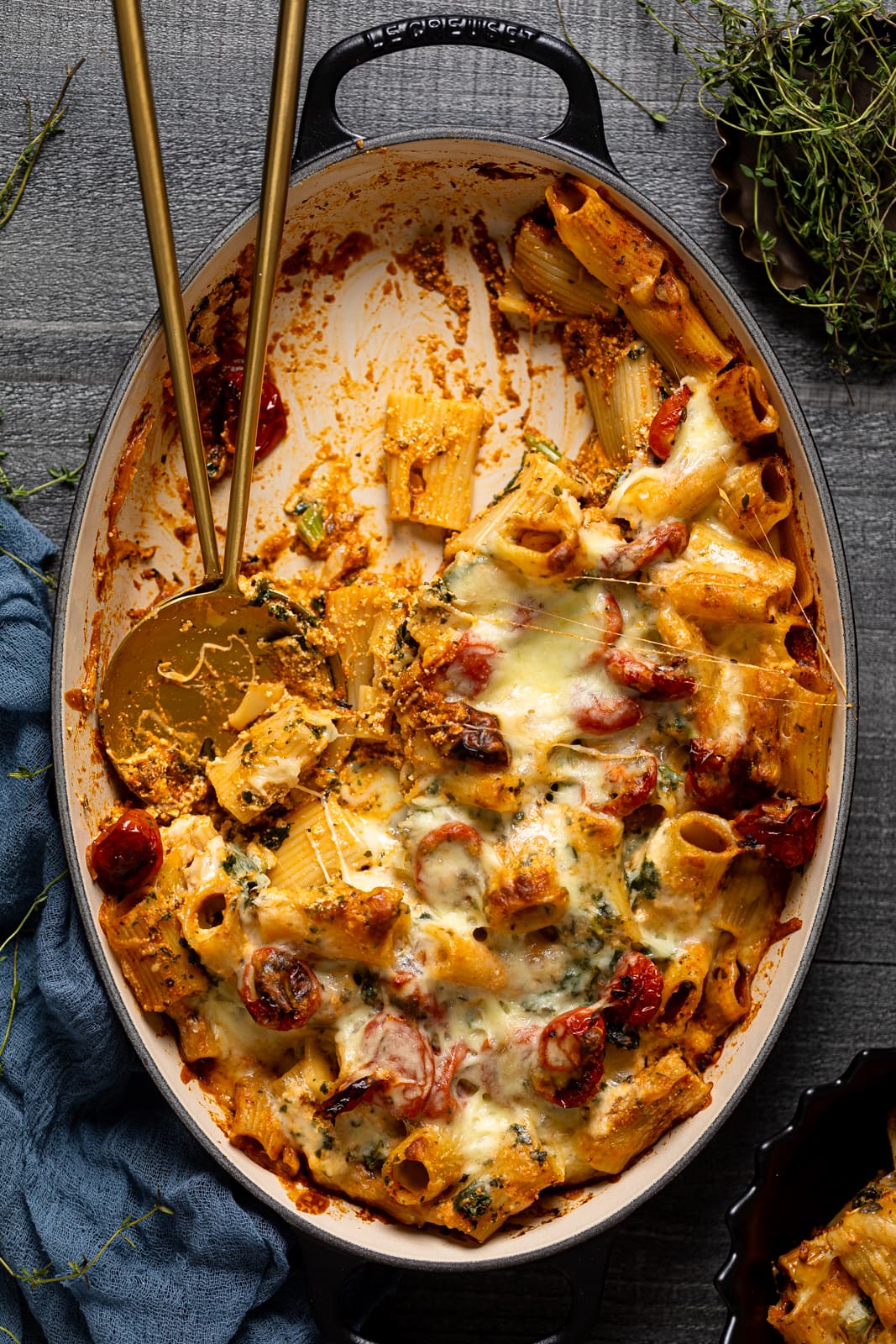 Half-empty Dutch oven of Meatless Baked Ziti with Ricotta and Mozzarella