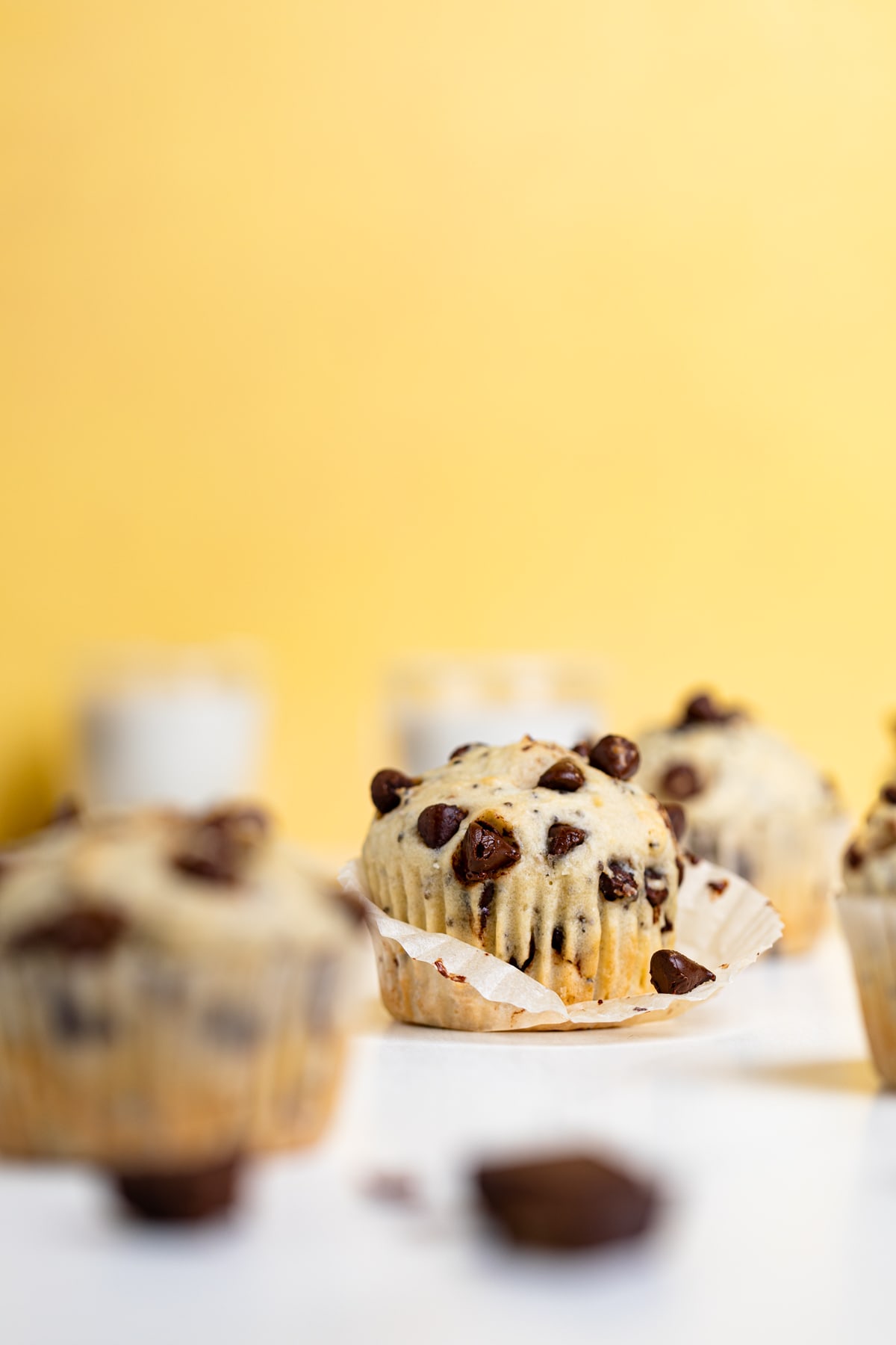 Chocolate Chip Chia Seed Energy Muffin with its muffin liner half peeled off