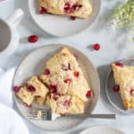 Cranberry Orange Breakfast Scone on a plate with a fork.