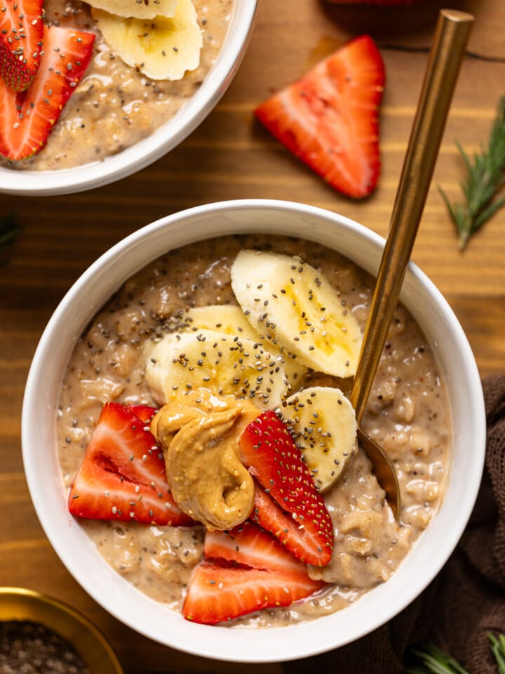 Up close shot of bowl with fruits and spoon.