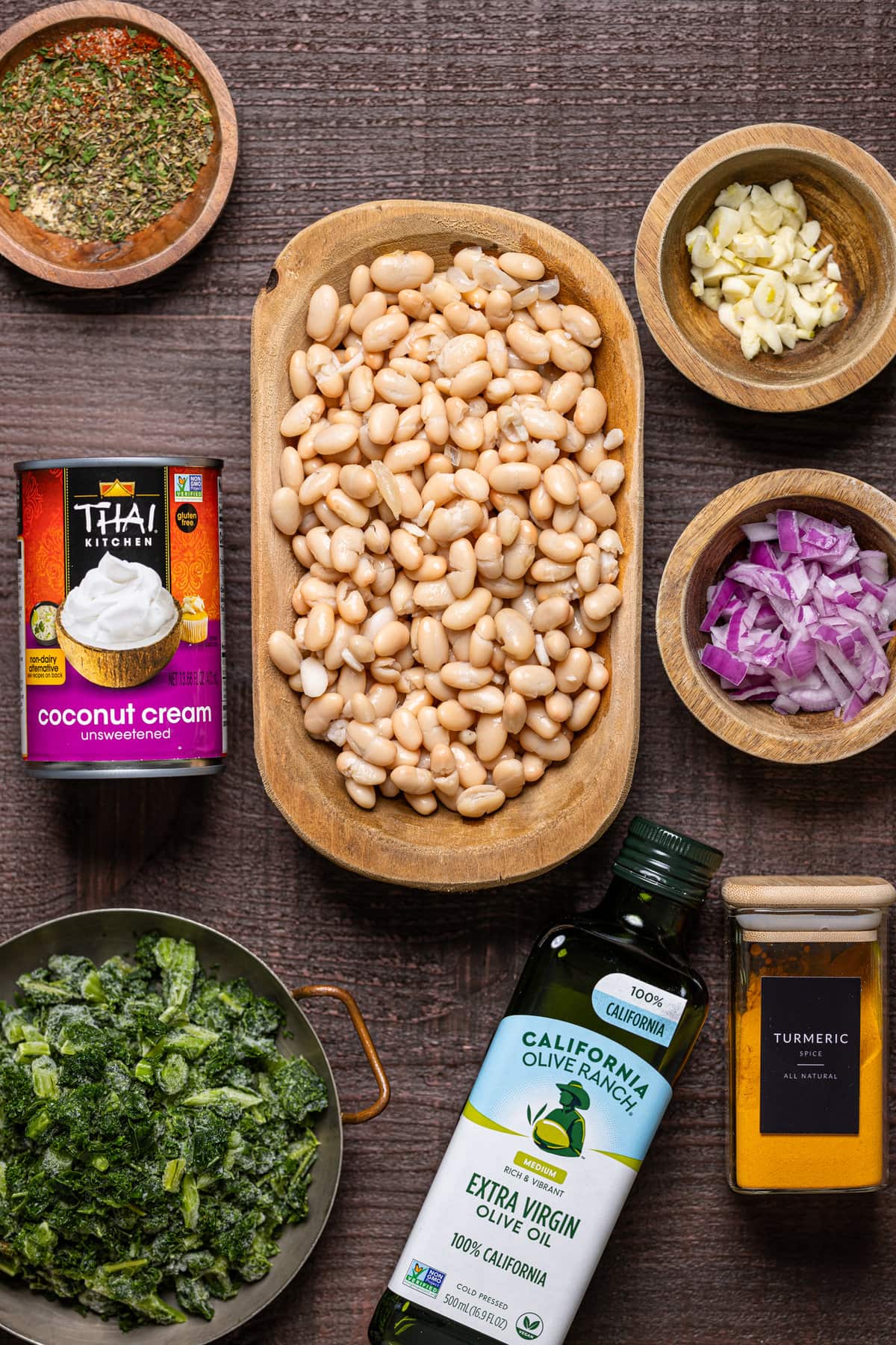 Ingredients for Creamy Vegan White Bean Soup including coconut cream, red onion, and turmeric