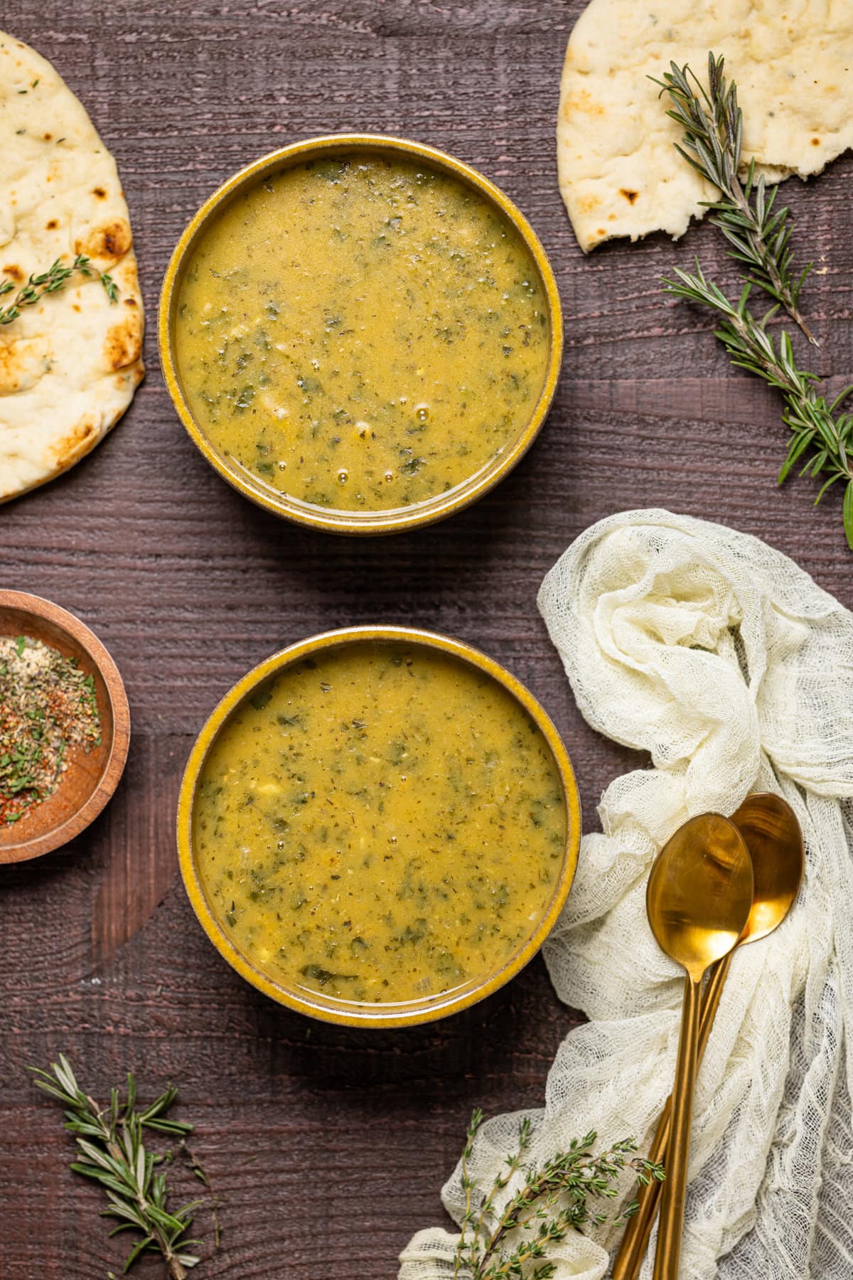 Overhead shot of two bowls of Creamy Vegan White Bean Soup 