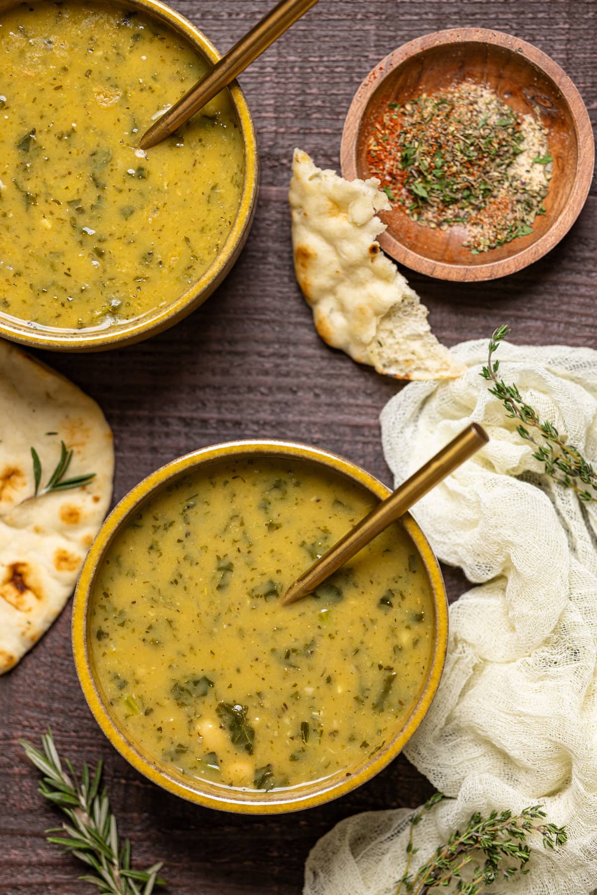 Bowl of Creamy Vegan White Bean Soup with a spoon