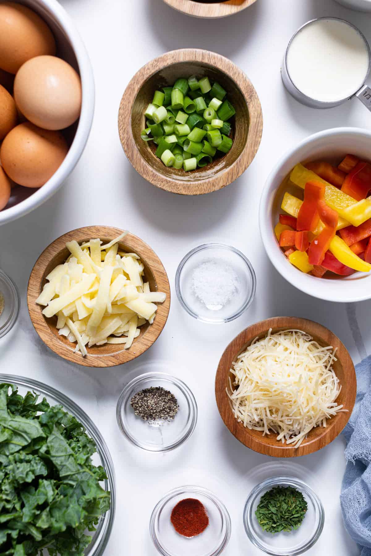 Veggie Frittata ingredients including eggs, bell peppers, and cheese.