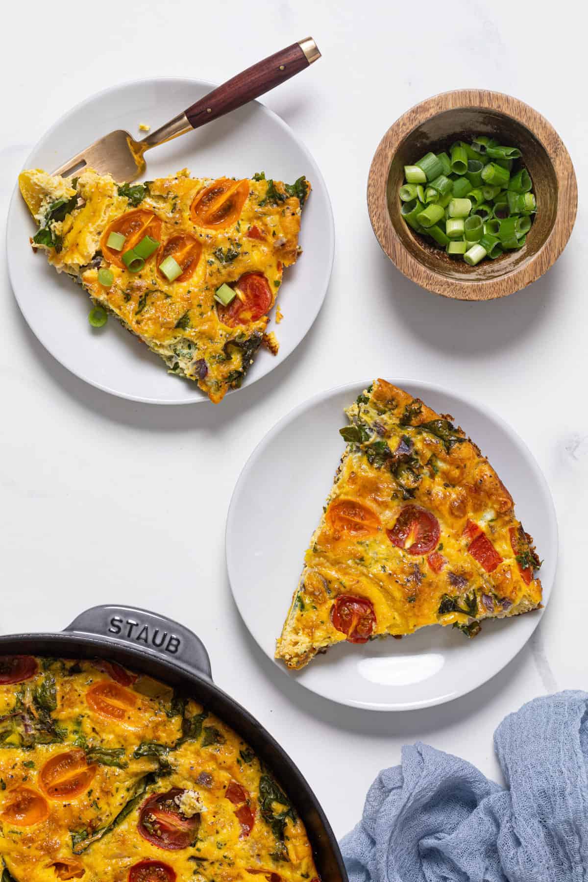 Slices of Veggie Frittata on plates.