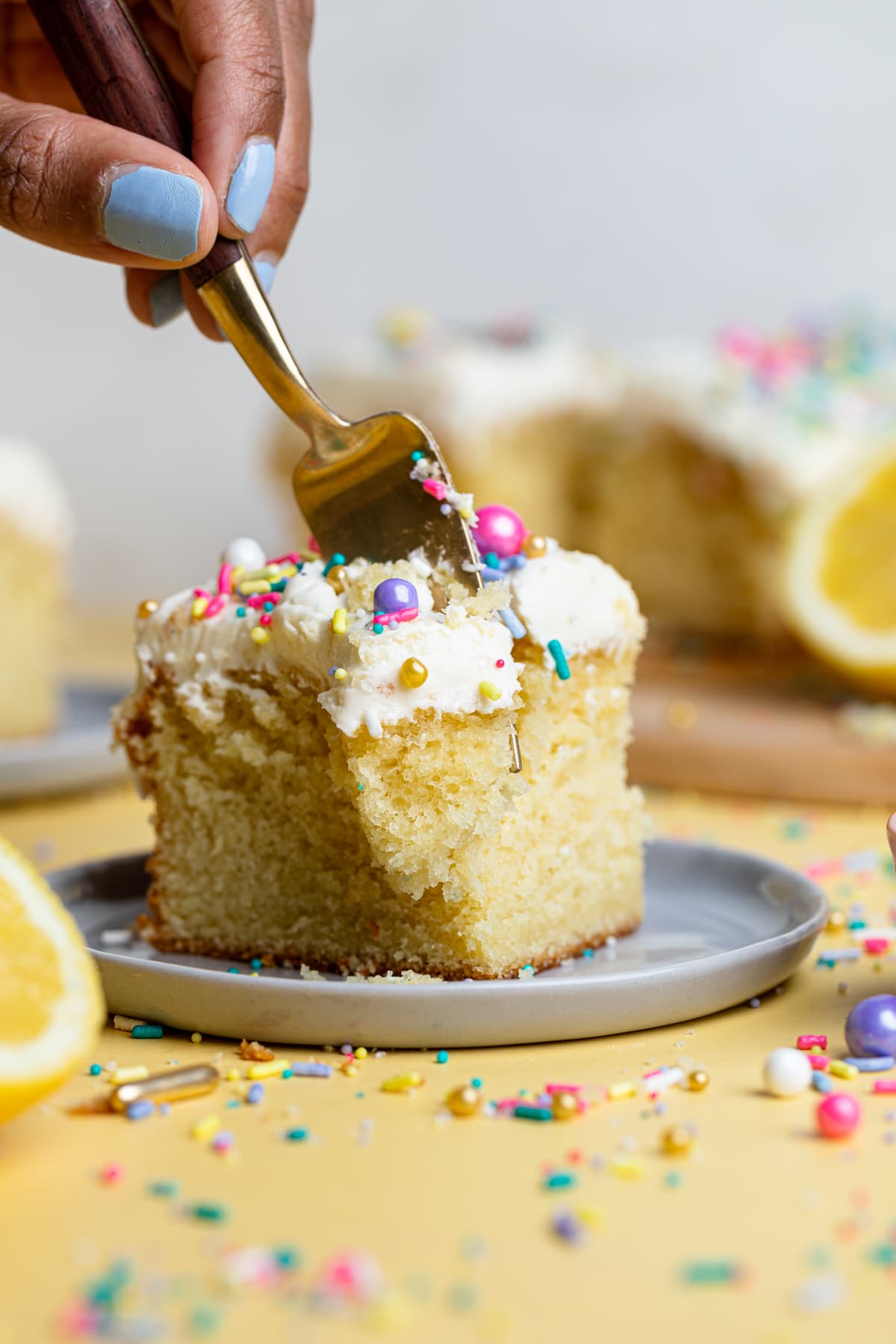 Fork grabbing some Lemon Birthday Sheet Cake.