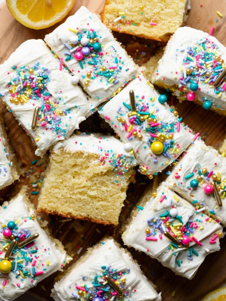 Cut pieces of Lemon Birthday Sheet Cake topped with sprinkles.