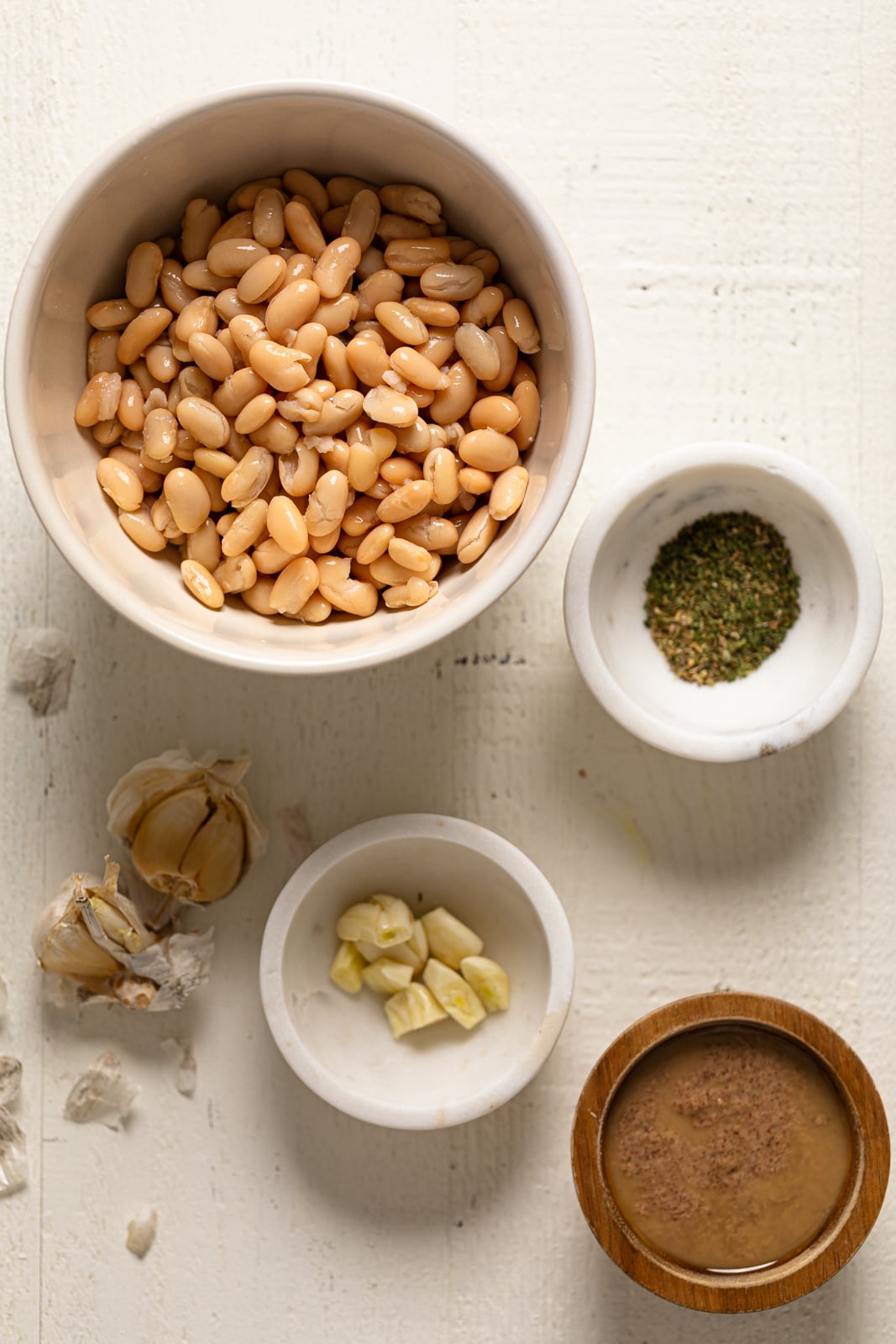 Ingredients for Garlic Herb Three Bean Dip including beans, garlic, and seasonings