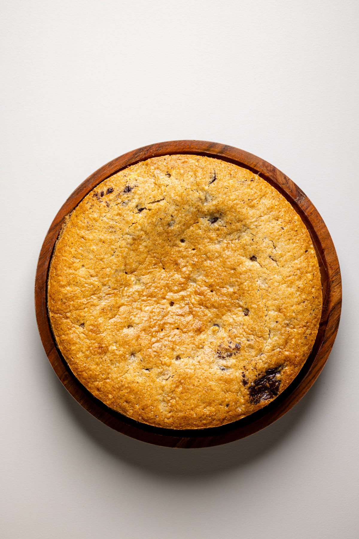 Vegan Chocolate Chip Banana Cake in a wooden bowl.