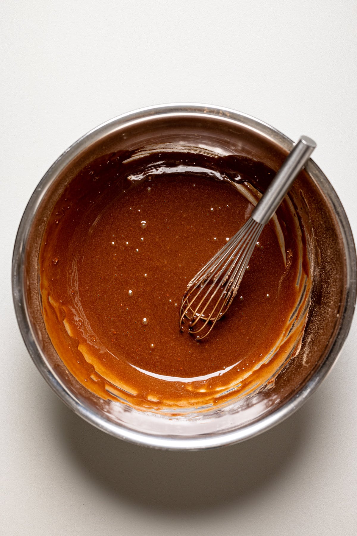 Whisk in a bowl of chocolate.