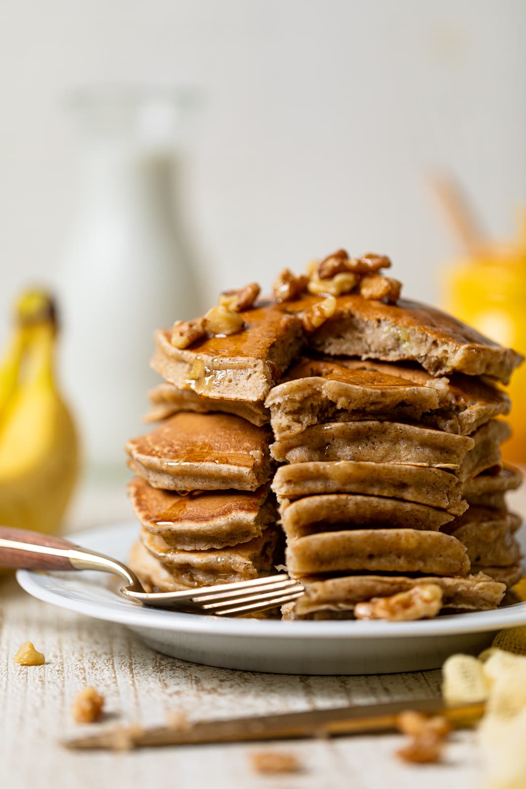 Stack of Healthy Banana Bread Pancakes with slices cut out