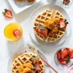 Plates of Sweet and Spicy Cauliflower Bites over Maple Pecan Waffles.