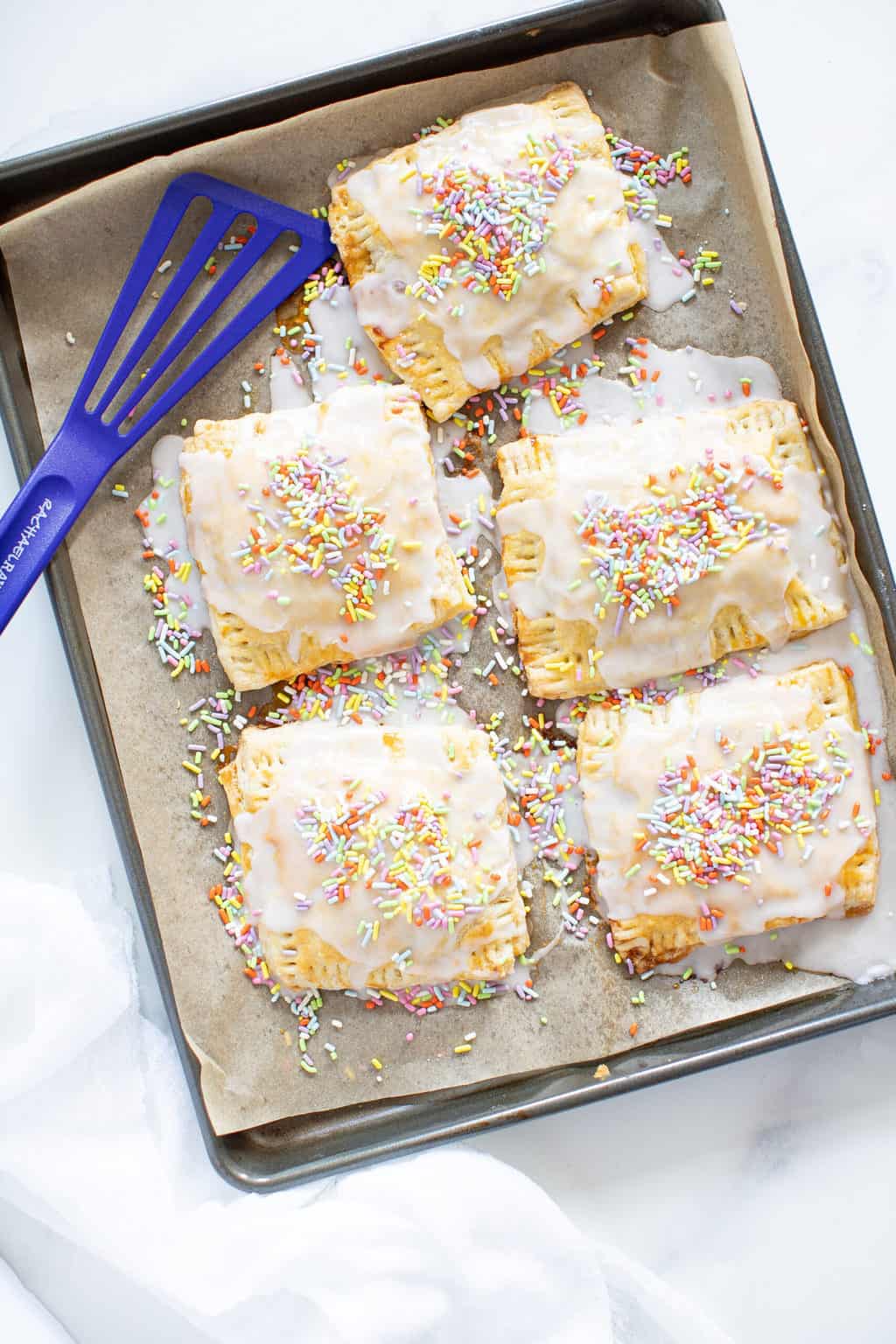 Vegan Apricot Pop Tarts on a lined baking sheet.