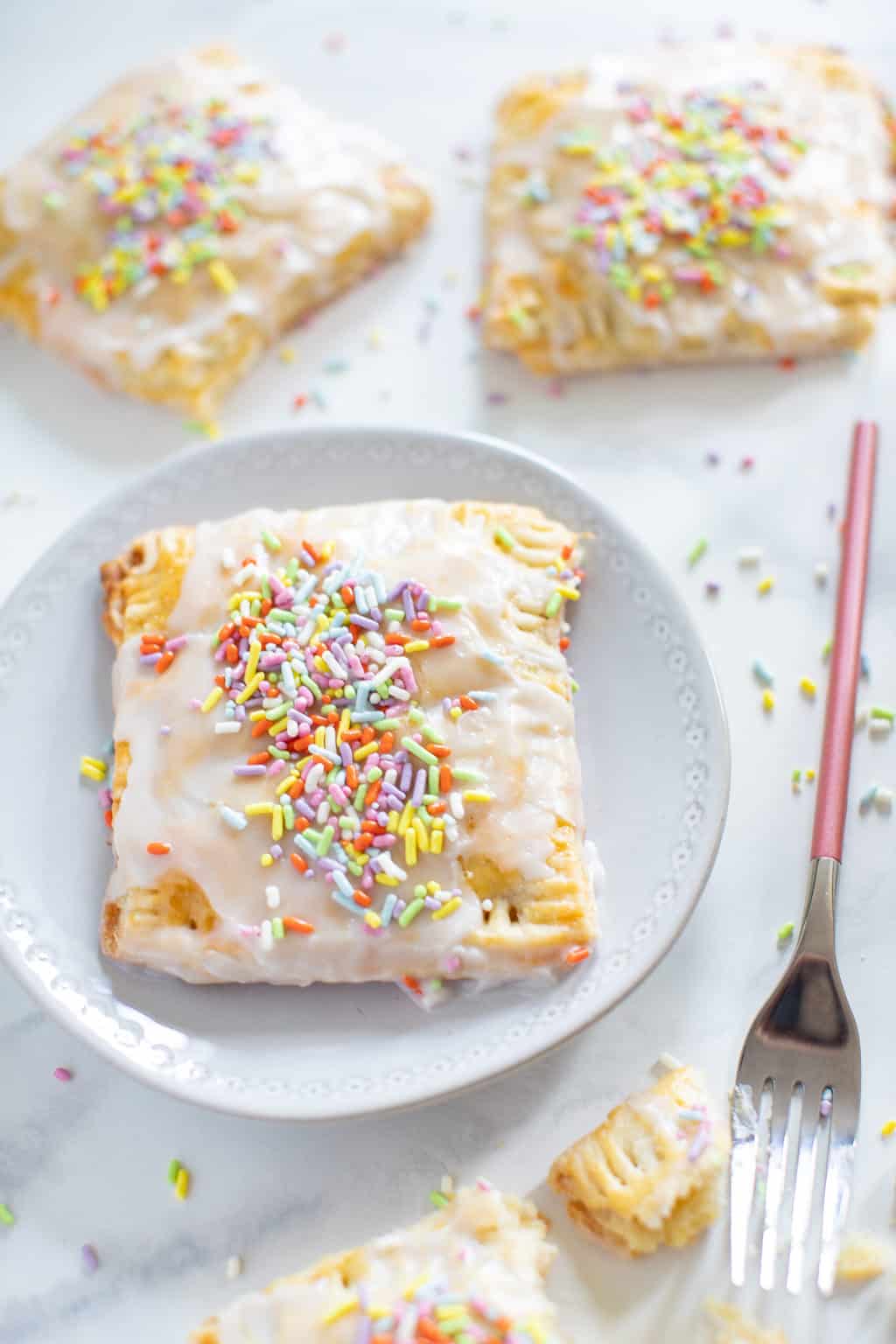 Vegan Apricot Pop Tarts topped with sprinkles.