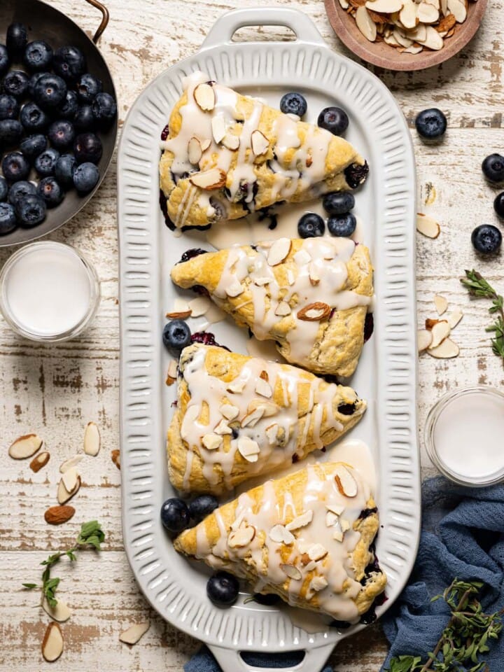 Dairy-Free Blueberry Almond Scones on an oblong plate.