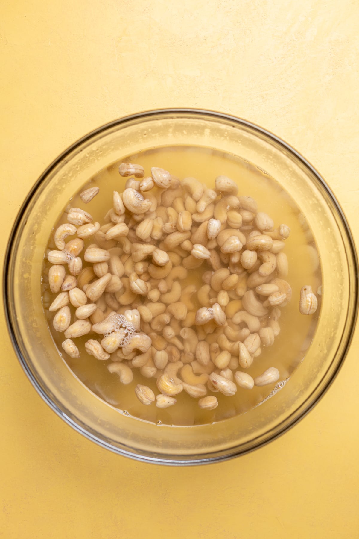 Cashews in a bowl of water