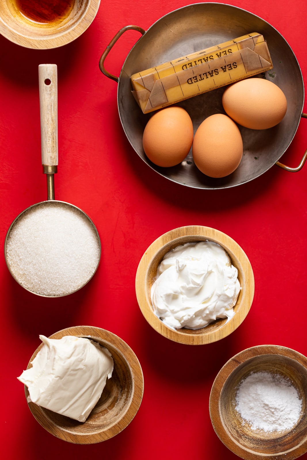 Ingredients for Cream Cheese Pound Cake including eggs, butter, and cream cheese.