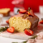 Cream Cheese Pound Cake with Strawberry Glaze on a serving board.