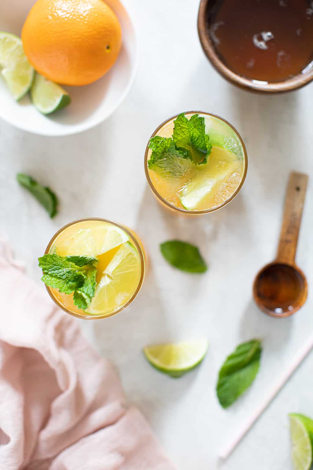 Two glasses of Citrus Honey Lime Mint Mocktail.