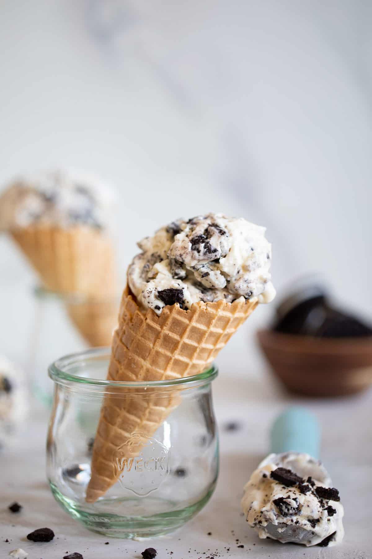 No-Churn Cookies and Cream Ice Cream in a cone standing in a glass.