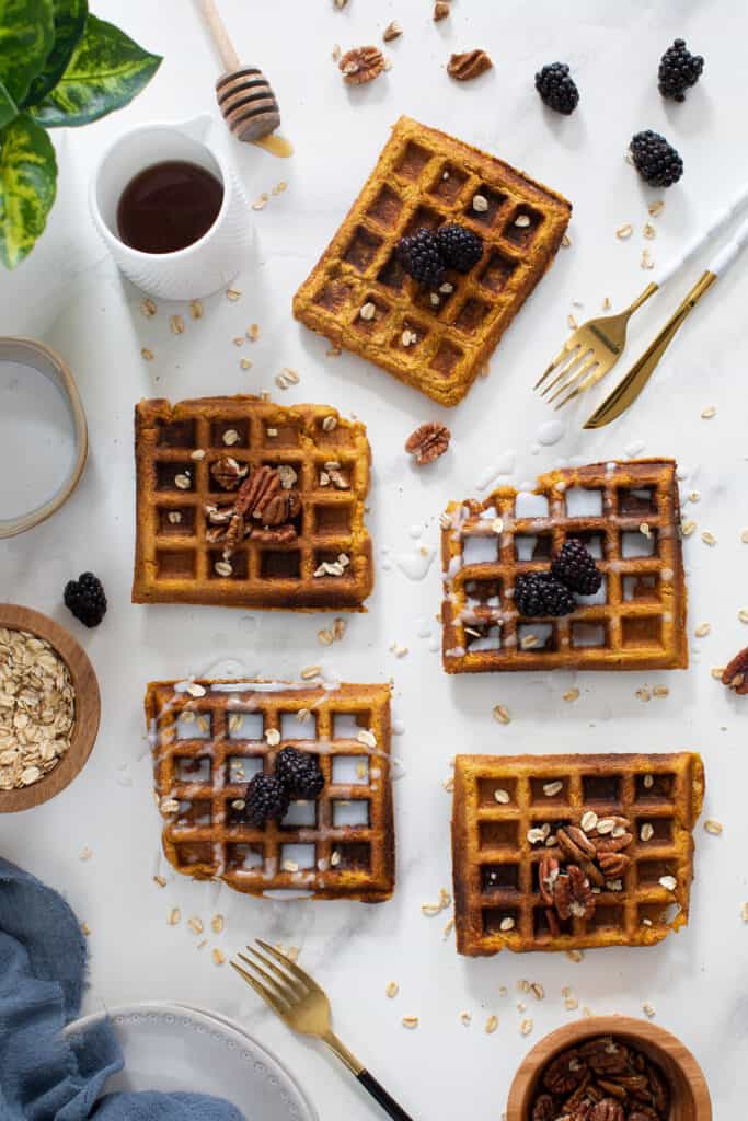 Flourless Vegan Sweet Potato Oats Waffles on a white surface.