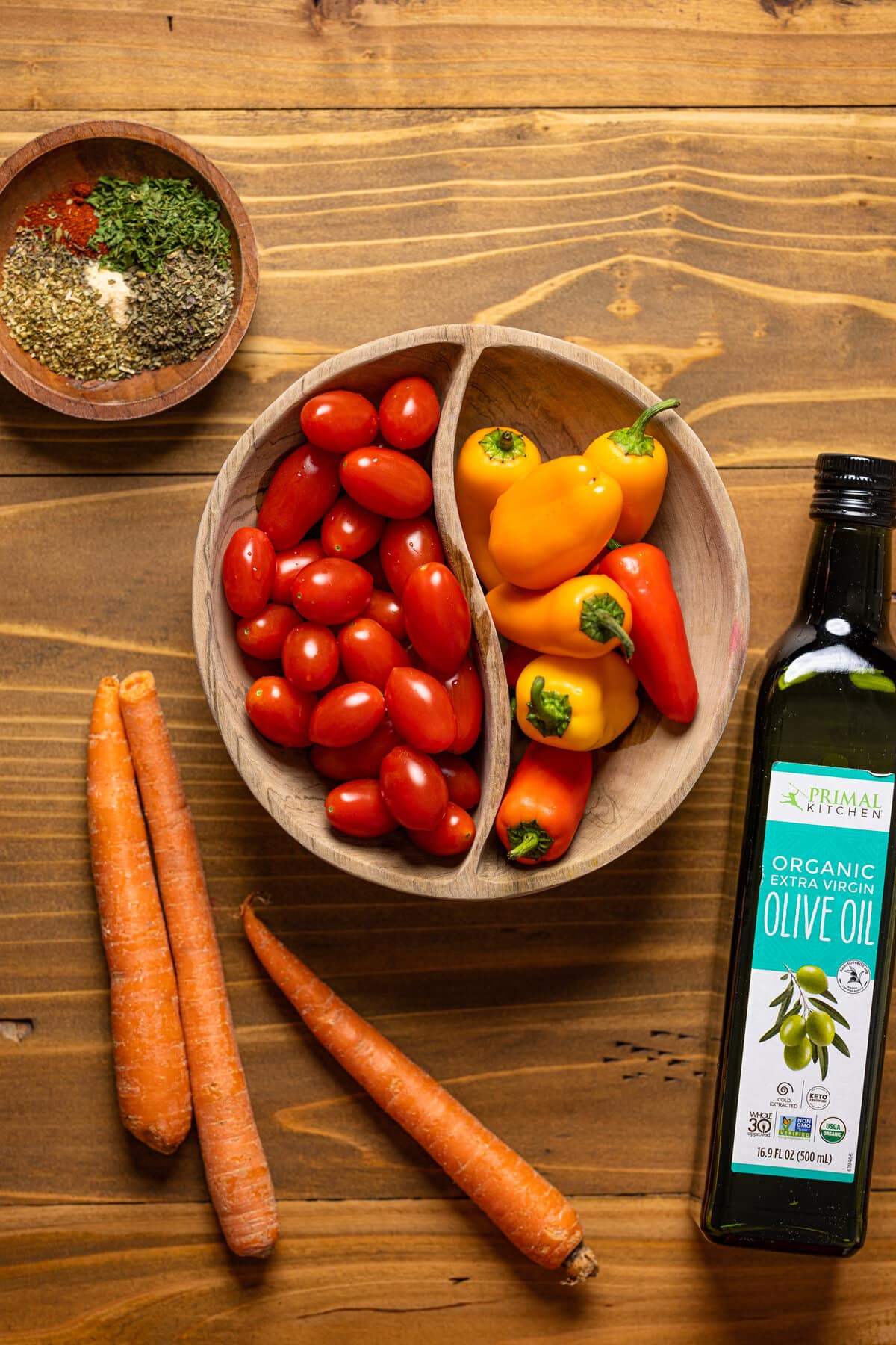 Ingredients for a Savory Chickpea Quinoa Buddha Bowl including peppers, carrots, and grape tomatoes