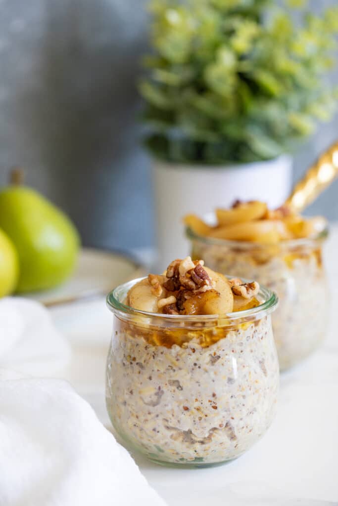 Two small glasses of Vanilla Overnight Oats and Maple Spiced Pears.