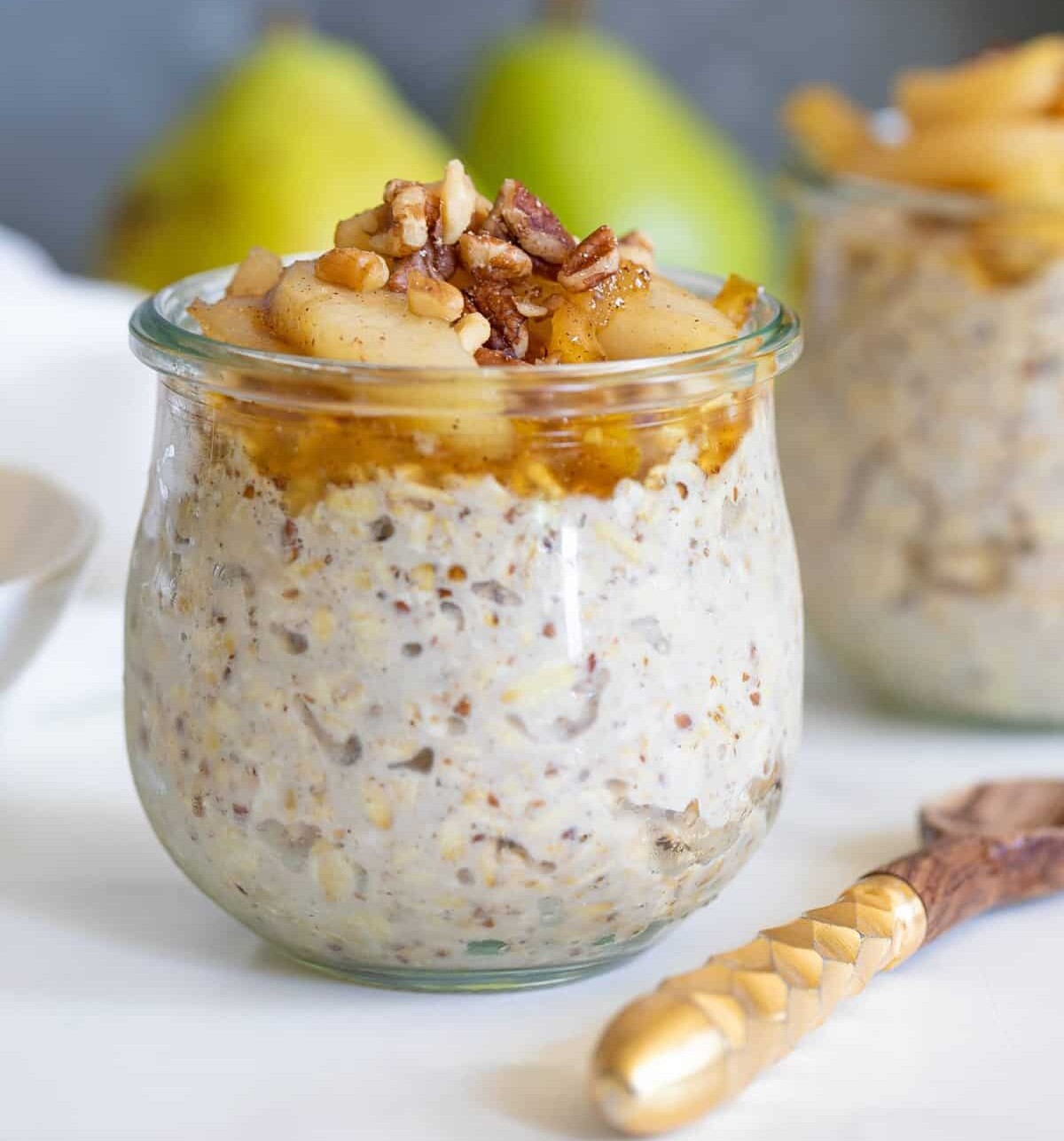 Closeup of a glass of Vanilla Overnight Oats with Maple Spiced Pears