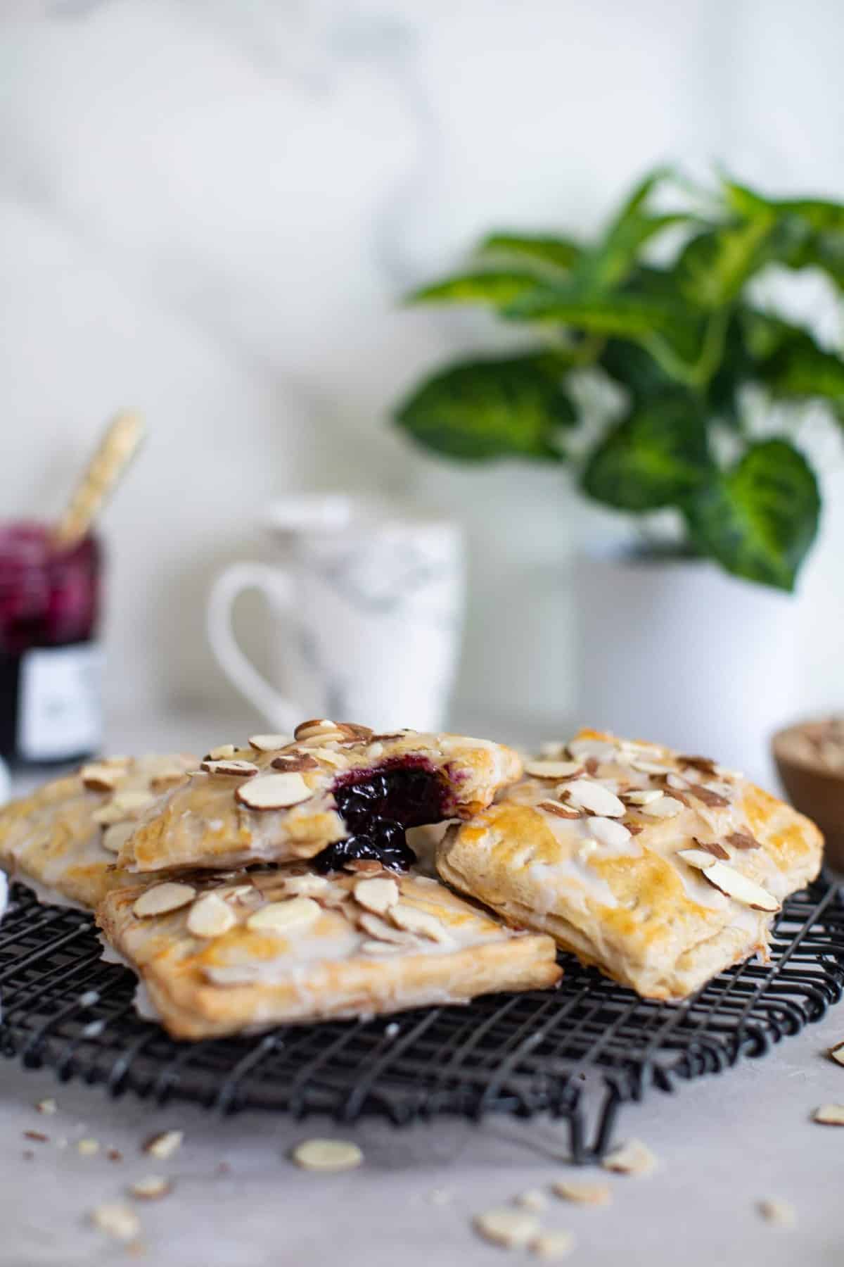 Wild Blueberry Almond Pop Tarts on a wire rack.