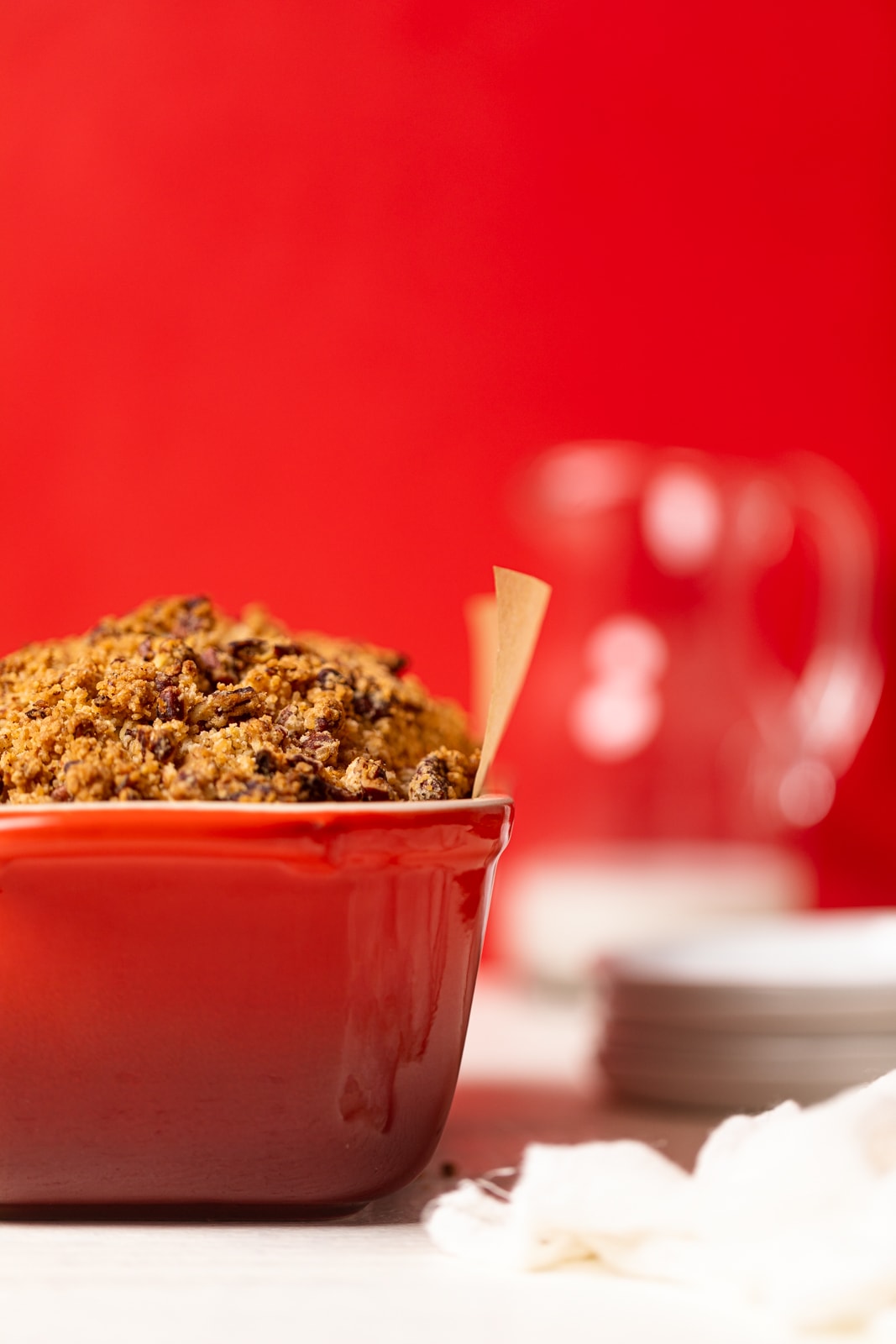 Vegan Apple Bread in a red bread pan.