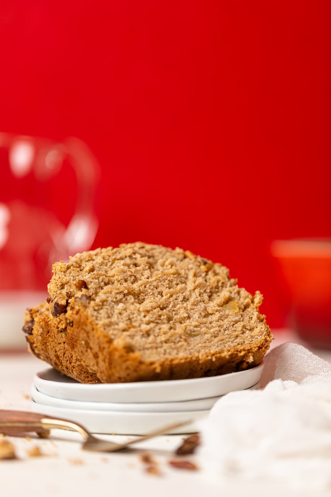 Slices of Vegan Apple Bread  on small, stacked plates.