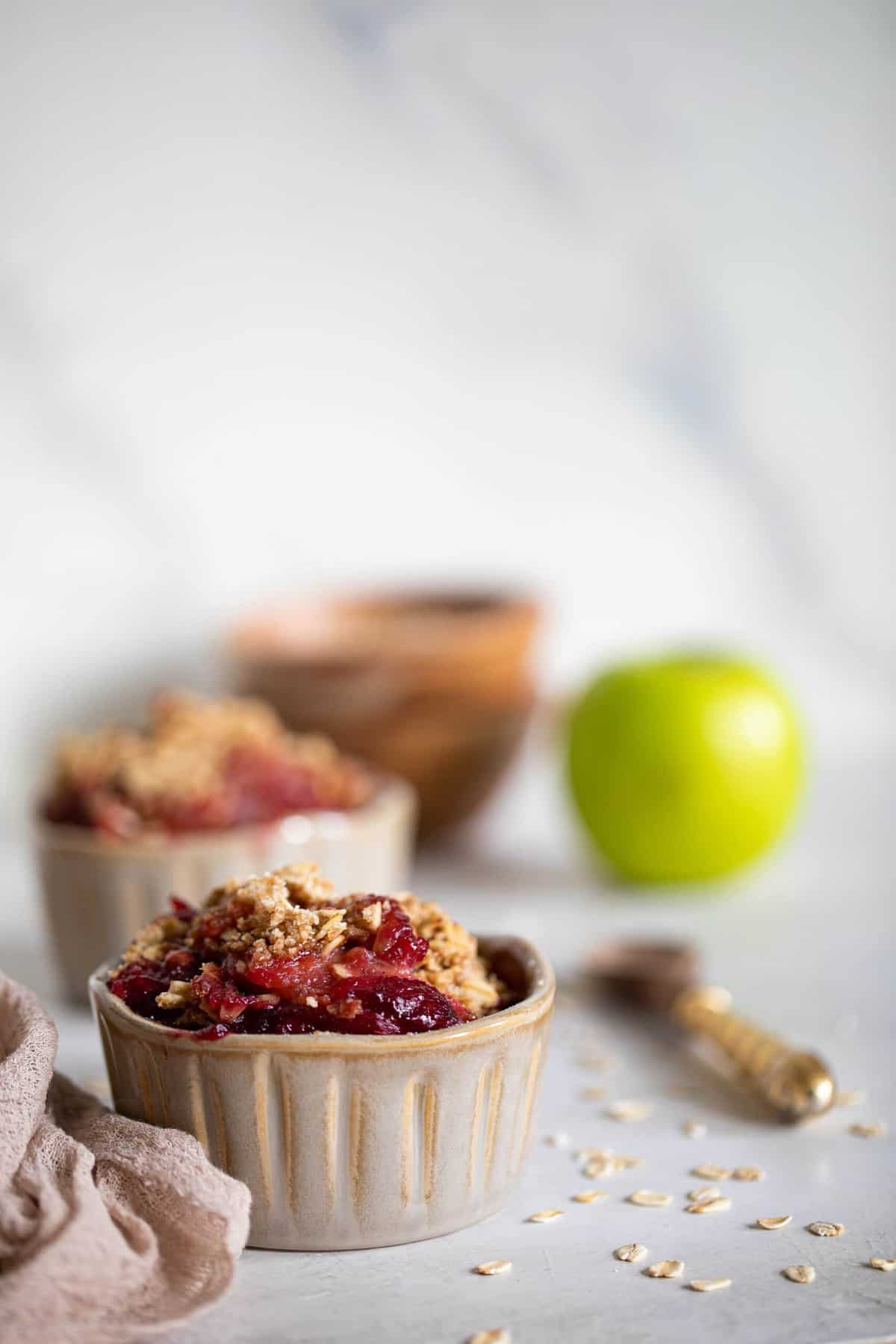 Small bowls of Vegan and Gluten-Free Apple Plum Crisp.