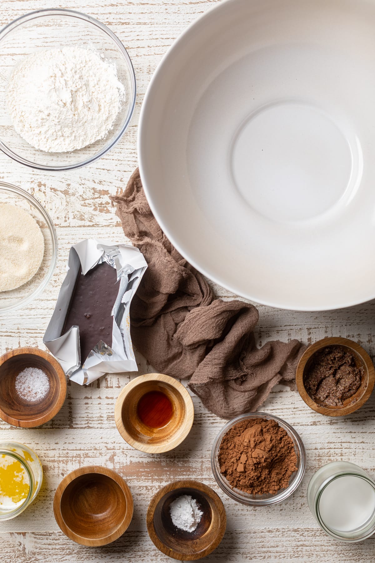 Ingredients for Extra Fudgy Vegan Brownies around an empty bowl.