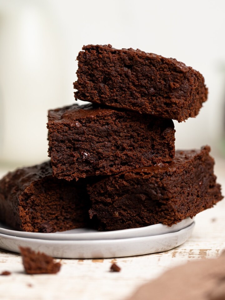 Pile of Extra Fudgy Vegan Brownies on a plate.