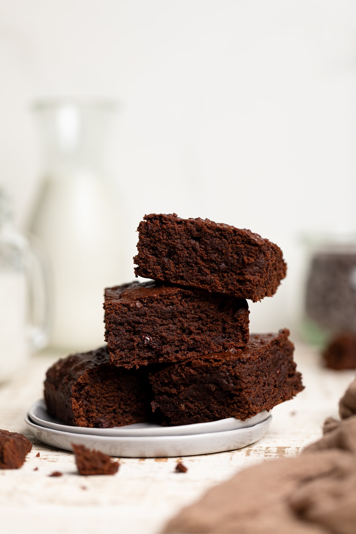 Pile of Extra Fudgy Vegan Brownies on a plate.