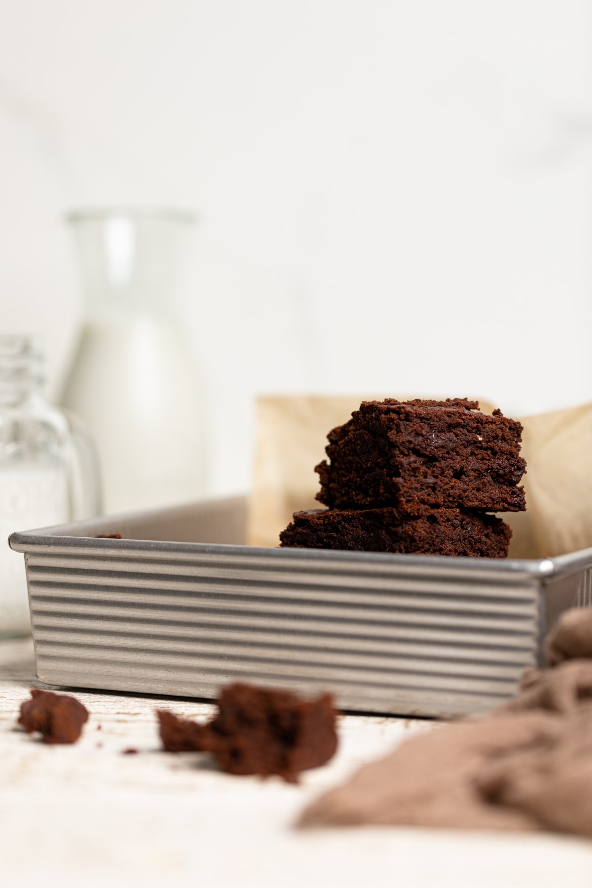 Extra Fudgy Vegan Brownies stacked in a pan.