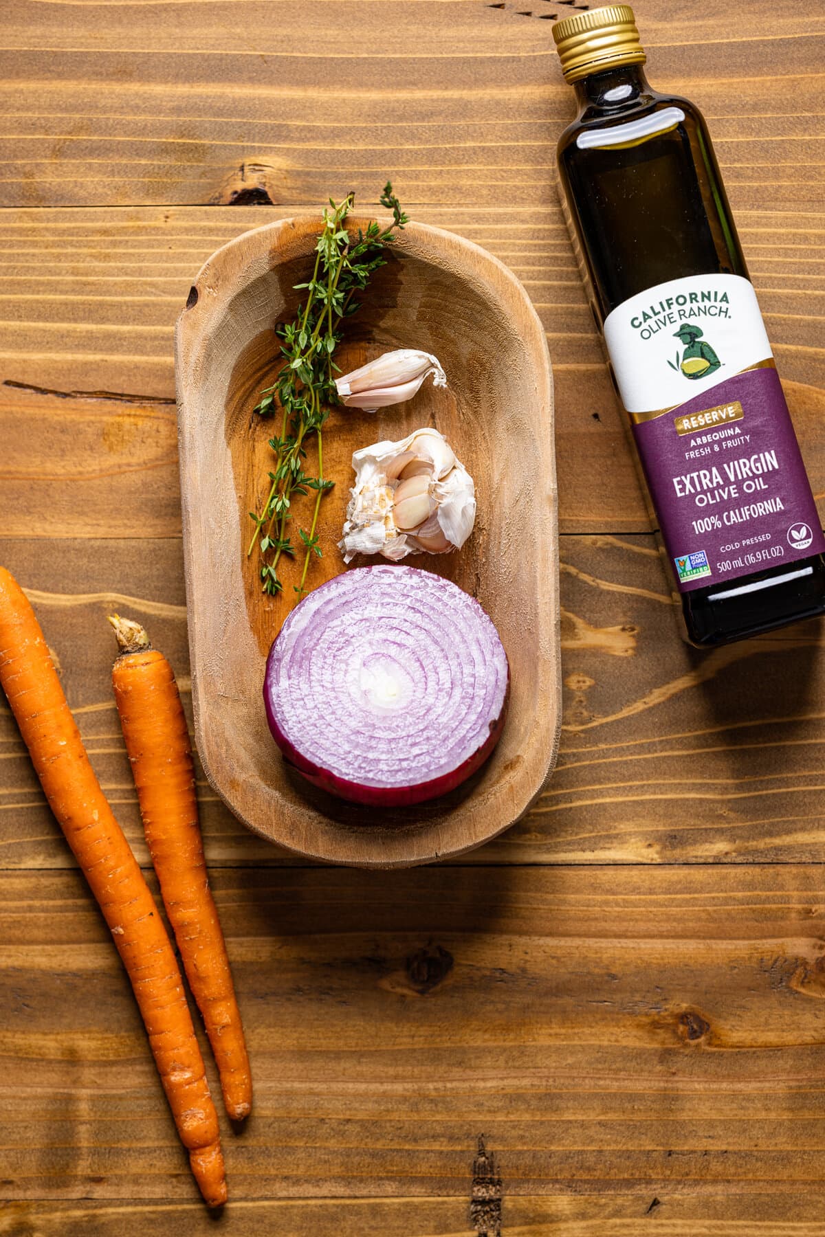 Ingredients for Sweet Potato Veggie Soup including red onion, garlic, and thyme